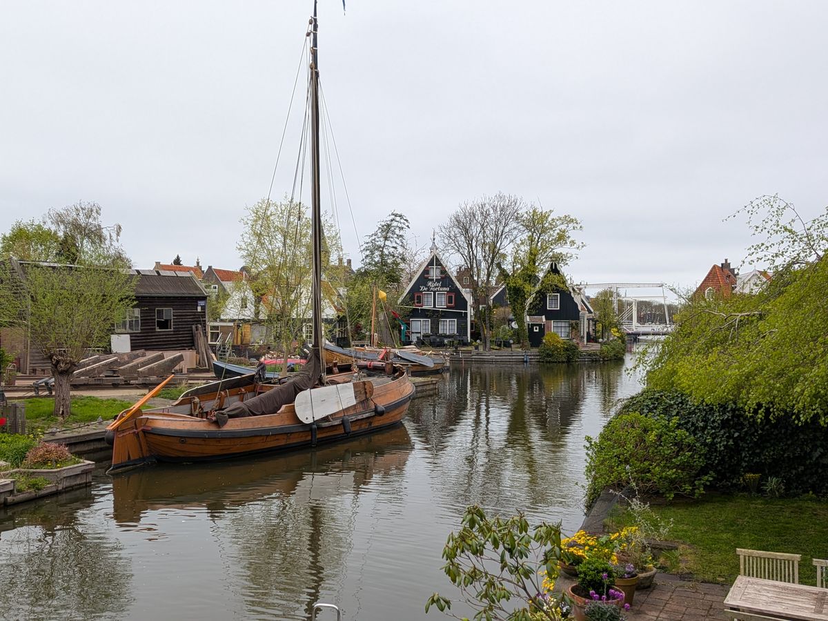 Historic wooden sailing boat in the old harbour of Edam