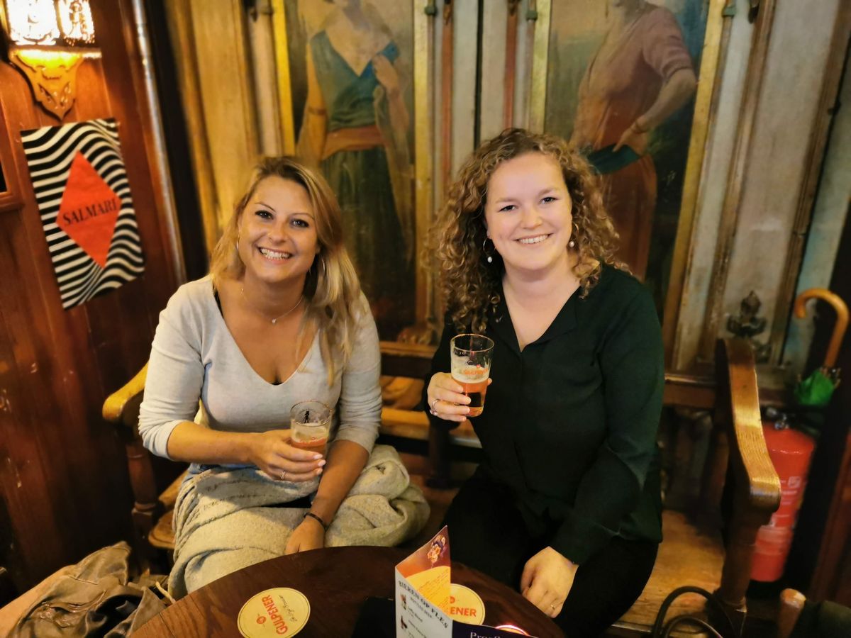 Toasting with a local beer in a traditional Amsterdam brown cafe