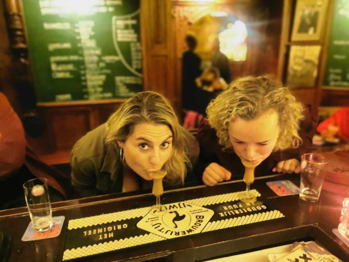 The traditional first sip of jenever from a tulip glass